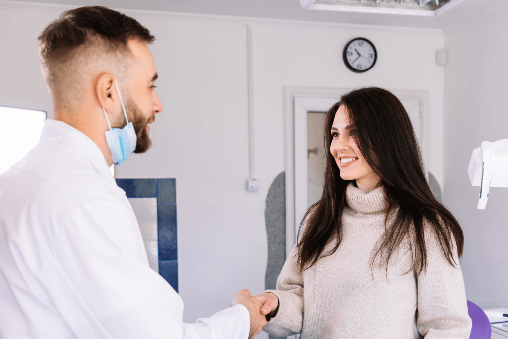 Smiling Patient Shaking Dentist Hand: What Dental Patients Really Want
